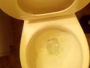 Young cock pissing in toilet tease?