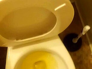 Young cock pissing in toilet tease?