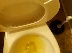 Young cock pissing in toilet tease?