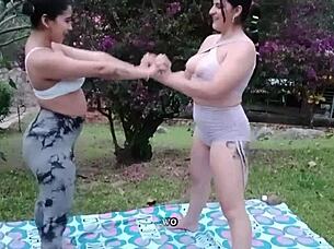 two busty latinas stretch in yoga poses before diving into each other's wet pussies