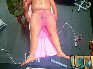 Chubby babe tricks him off massage bed for bdsm anal dildo domination