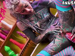 pierced tattooed goths fist and toy wildly