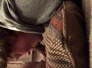 Mature mommy sucks hungrily while fingering her wet pussy