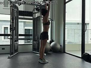 muscular brunette strips naked after sweaty gym workout