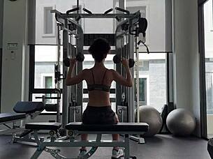 muscular brunette strips naked after sweaty gym workout