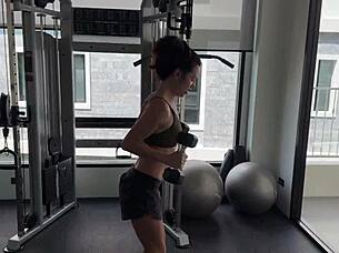 muscular brunette strips naked after sweaty gym workout