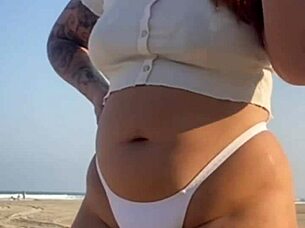 redhead flashes swollen pussy lips on beach