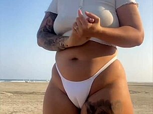 redhead flashes swollen pussy lips on beach