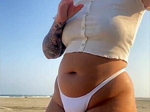 redhead flashes swollen pussy lips on beach