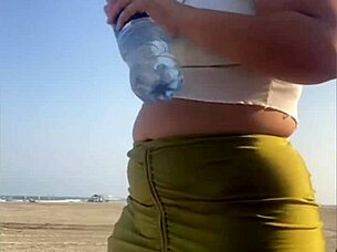 redhead flashes swollen pussy lips on beach