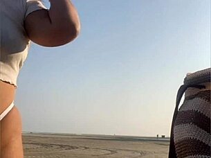 redhead flashes swollen pussy lips on beach