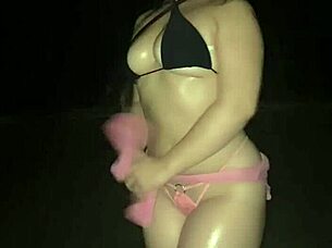 sexy girl teasing in micro panties on beach