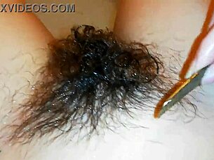 Hairy pussy lips glisten underwater in close-up fetish pool tease