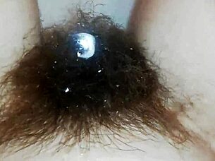 Hairy pussy lips glisten underwater in close-up fetish pool tease