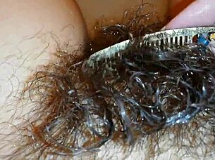 Hairy pussy lips glisten underwater in close-up fetish pool tease