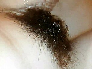 Hairy pussy lips glisten underwater in close-up fetish pool tease