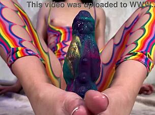 Teen brunette spreads big pussy lips on alien dildo bodystocking