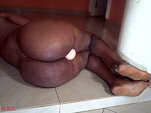 hey watch this horny african mom stuff her fat pussy with dildo!