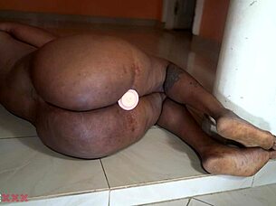 hey watch this horny african mom stuff her fat pussy with dildo!
