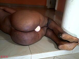 hey watch this horny african mom stuff her fat pussy with dildo!