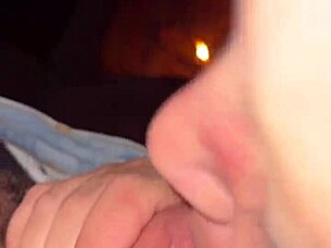 Wife teases wet pussy with huge cock by campfire outdoors
