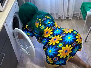 Hand stuck in washing machine, helper rescues her