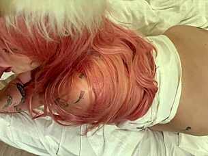 pink haired babe looks wild in straightjacket