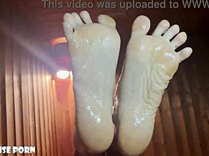 Petite latina's oiled feet stroke in steamy sauna heat