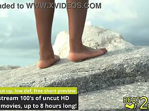 Giggling over giant hot rock foot rub on beach sands
