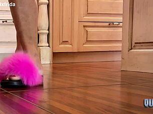 from furry slippers to bare tattooed toes in kitchen