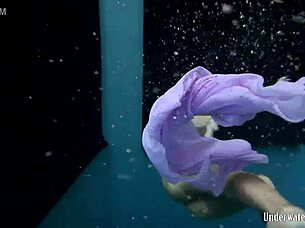 Blackhaired Aneta Splashes Nude In Pool Depths