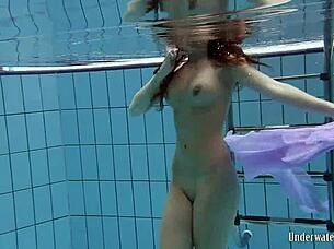 Blackhaired Aneta Splashes Nude In Pool Depths
