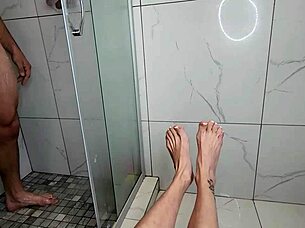 milf's feet stroke cock in steamy morning shower!