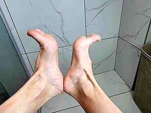 milf's feet stroke cock in steamy morning shower!