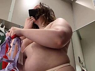 chubby brunette realizes wrong bra size in dressing room plump tits spill