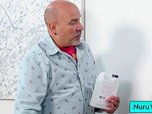 Sexy blonde Lilly Bell pours Nuru gel on naked body and rubs natural tits on client Codey Steele