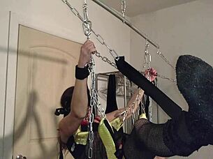 Rhianna dangles chained in the swing her shaved pussy and petite ass ready for bdsm torment part 1