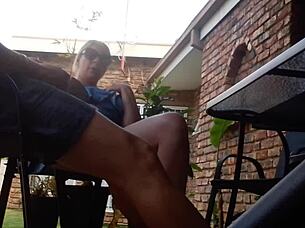 from an upskirt angle, outdoor fun unfolds with a massive toy in action under the skirt