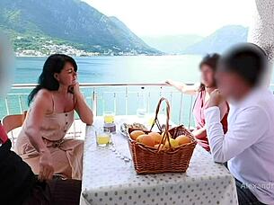 A daring public handjob unfolds on a hot cock in restaurant