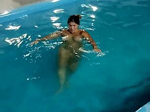 hot day redhead enjoys pool fully nude