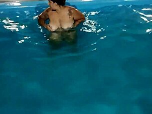 hot day redhead enjoys pool fully nude