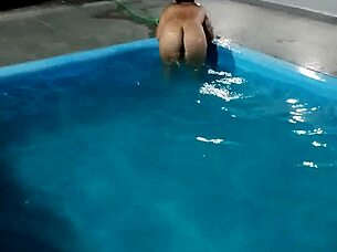 hot day redhead enjoys pool fully nude