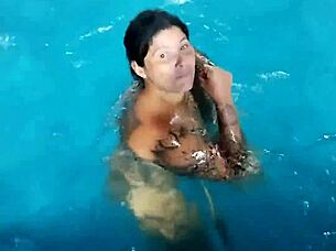 hot day redhead enjoys pool fully nude