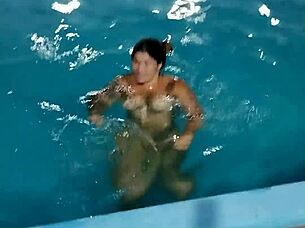 hot day redhead enjoys pool fully nude