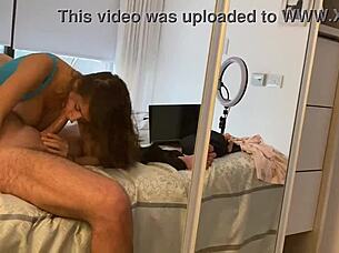 young hottie sneaks blowjob while wife works away