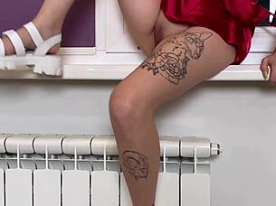 Busty brunette hits bright orgasm fingering in kitchen chair