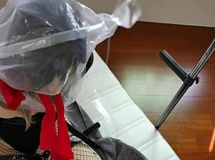 doll plays self-bondage in latex catsuit outdoors