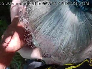 this sexy mature babe drops to her knees sucking cock deep in the forest