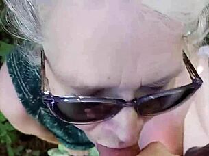 this sexy mature babe drops to her knees sucking cock deep in the forest