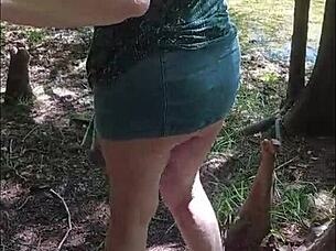 this sexy mature babe drops to her knees sucking cock deep in the forest